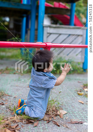 Infants playing in the park 58245318