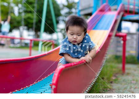 Infants playing in the park 58245476