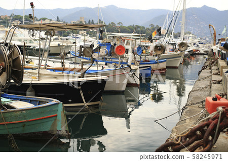 Old fishing boat with tackle in Italy 58245971