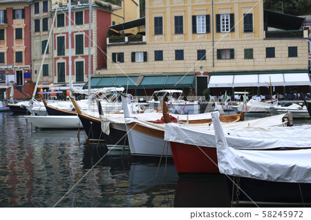 Old fishing boat with tackle in Italy 58245972
