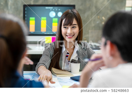 Asian attractive woman talking and discussion with colleague in meeting room. 58248663
