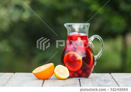 Refreshing sangria or punch with fruits in pincher Refreshing sangria or punch with fruits in pincher 58248869