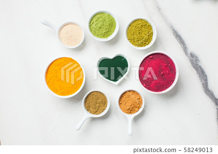 Superfood smoothie boosters, various dietary supplements in bowls 58249013