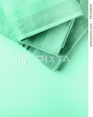 Pastel color clean folded towels. Mint green Pastel color clean folded towels. Mint green 58249644