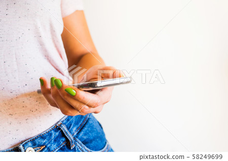 Young woman using mobile phone Young woman using mobile phone 58249699