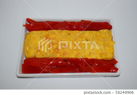Spanish flag made with potato omelette, typical Spanish food and bell peppers. Spanish flag made with potato omelette, typical Spanish food and bell peppers. 58249906
