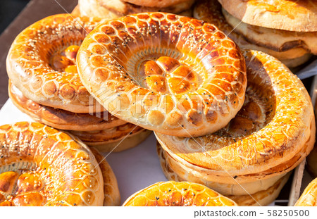 Appetizing uzbek flat breads from the tandir Appetizing uzbek flat breads from the tandir 58250500