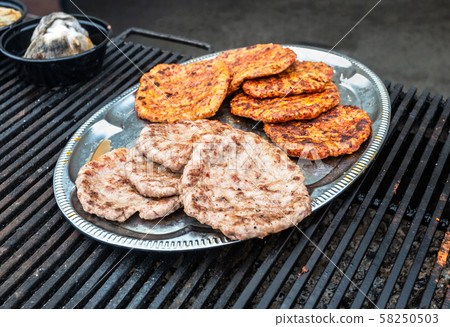 Appetizing pieces of grilled meat cooked on the 58250503
