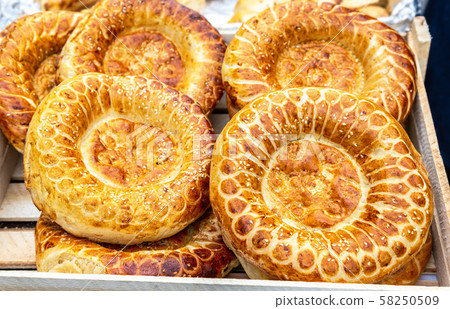 Appetizing uzbek flat breads from the tandir Appetizing uzbek flat breads from the tandir 58250509