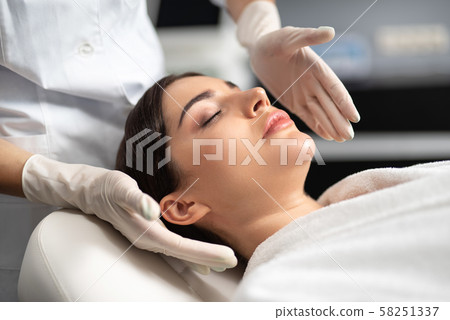 Beautiful young woman spending time at spa salon Beautiful young woman spending time at spa salon 58251337