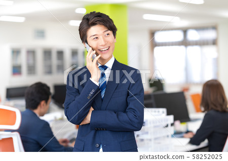Businessman, office, suit, smartphone 58252025