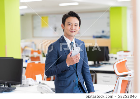 Businessman, office, suit, smartphone 58252840