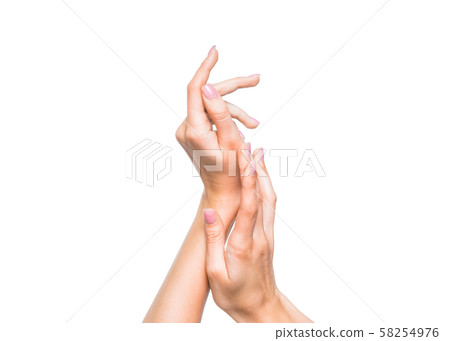 Female hands over white background. Applying cream. Female hands over white background. Applying cream. 58254976