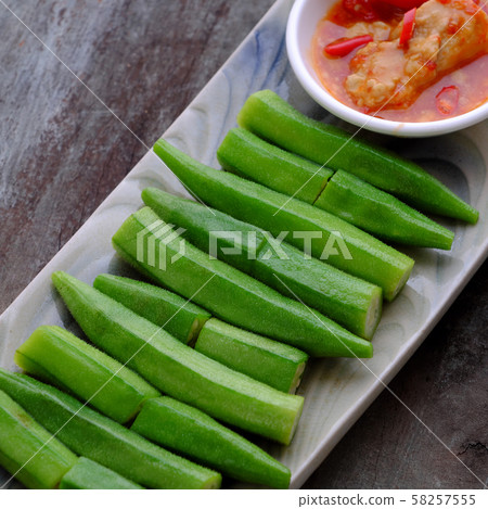 rectangle plate boiled okra with fermented tofu on wooden background rectangle plate boiled okra with fermented tofu on wooden background 58257555