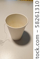 Paper cup filled with tea 58261310