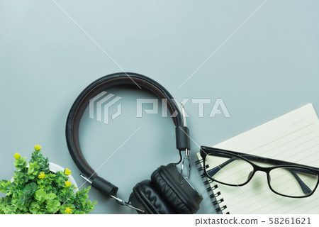 notebook glasses and earphones on gray background notebook glasses and earphones on gray background 58261621