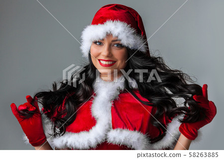 Christmas Woman in Santa Hat Christmas Woman in Santa Hat 58263885