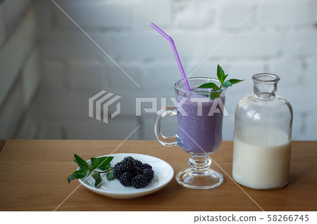 Close-up blackberry smoothie in a glass cup, a Close-up blackberry smoothie in a glass cup, a 58266745