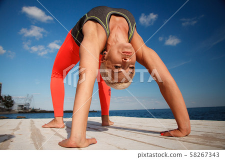 Close-up portrait of adult blond woman with short 58267343
