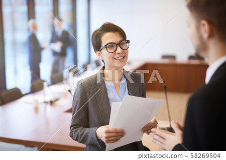 Smiling Young Businesswoman in Conference Room Smiling Young Businesswoman in Conference Room 58269504