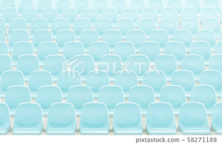 Light blue rows of seats on the stadium . Light blue rows of seats on the stadium . 58271189