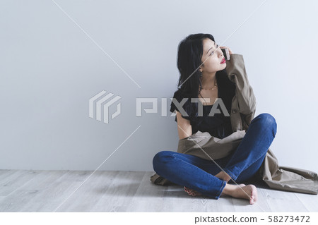 Woman using a smartphone Woman using a smartphone 58273472