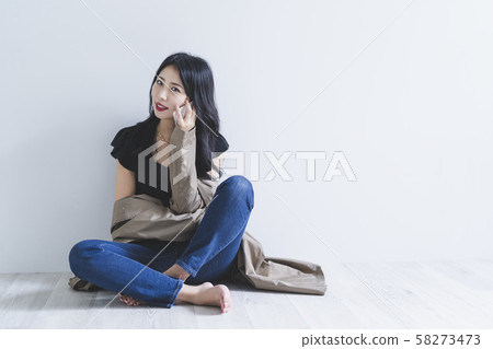 Woman using a smartphone Woman using a smartphone 58273473