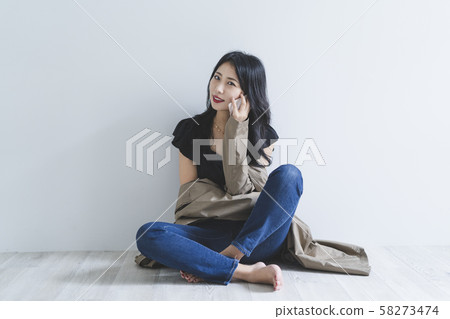 Woman using a smartphone Woman using a smartphone 58273474