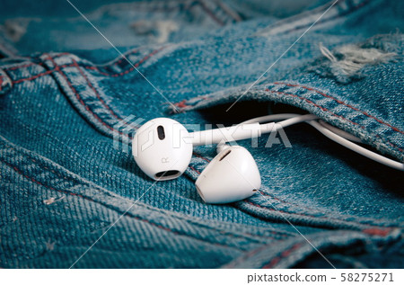 Earphones in the jeans pocket Earphones in the jeans pocket 58275271