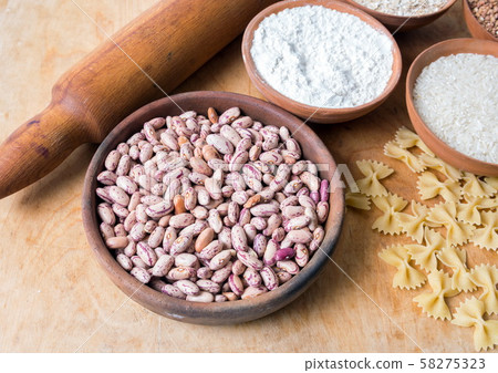 Baking ingedients. Flour and pasta on table 58275323