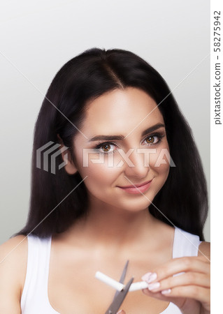 No smoking. A ban on smoking. A girl loses cigarettes. Against smoking The concept of health care 58275942