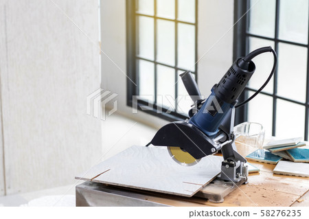 Preparing tile work by using saws machine in work site. 58276235