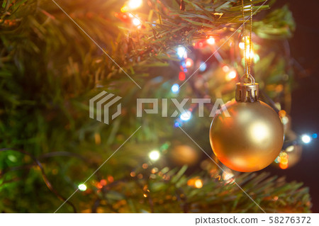 Christmas decoration. Hanging gold balls on pine Christmas decoration. Hanging gold balls on pine 58276372