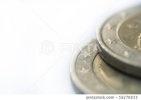 Close up Stack of coins on white background with 58276833