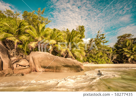 Retro style image of tropical island beach Anse Lazio, Praslin, Seychelles 58277435