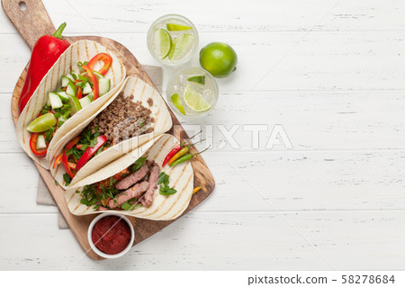Mexican tacos and caipirinha cocktail Mexican tacos and caipirinha cocktail 58278684