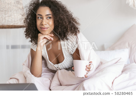 Positive delighted female person feeling the harmony Positive delighted female person feeling the harmony 58280465