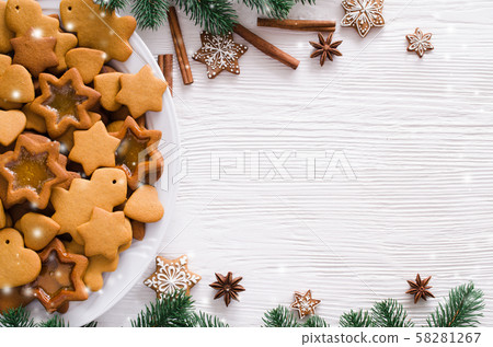 Christmas and culinary background with a plate of freshly baked Christmas gingerbread Christmas and culinary background with a plate of freshly baked Christmas gingerbread 58281267