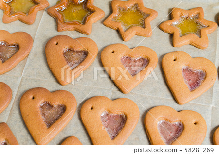 Freshly baked Christmas gingerbread ready to decorate with icing. Freshly baked Christmas gingerbread ready to decorate with icing. 58281269