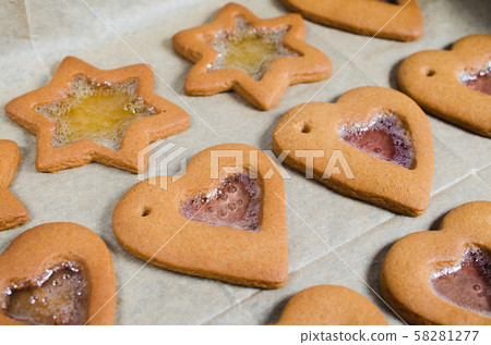 Freshly baked Christmas gingerbread ready to decorate with icing. Freshly baked Christmas gingerbread ready to decorate with icing. 58281277