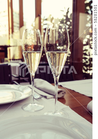 two glasses of tasty white wine at a restaurant 58281501