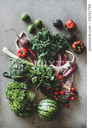 Fresh vegetables, greens and fruits over grey 58281799