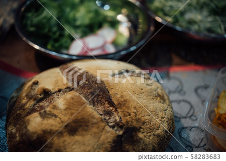 Sourdough bread with vegetable salad at restaurant 58283683