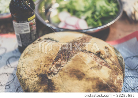 Sourdough bread with vegetable salad at restaurant 58283685