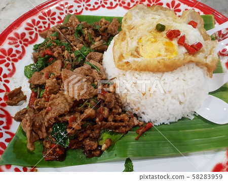 Rice topped with stir-fried pork or beef and basil Rice topped with stir-fried pork or beef and basil 58283959