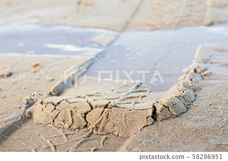 Wheel marks on sand. Wheel marks on sand. 58286951