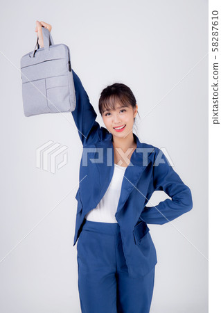 Beautiful portrait young business asian woman holding a briefcase portfolio isolated Beautiful portrait young business asian woman holding a briefcase portfolio isolated 58287610