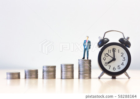 Miniature people businessman standing on Money Miniature people businessman standing on Money 58288164