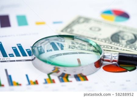 Magnifying glass on charts graphs spreadsheet paper. Financial development, Banking Account, Statistics, Investment Analytic research data economy, Stock exchange trading, Business office company 58288952