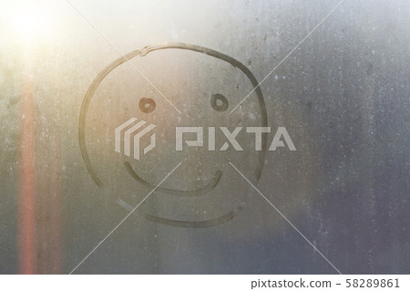 handmade inscription on the sweaty glass smiley. handmade inscription on the sweaty glass smiley. 58289861